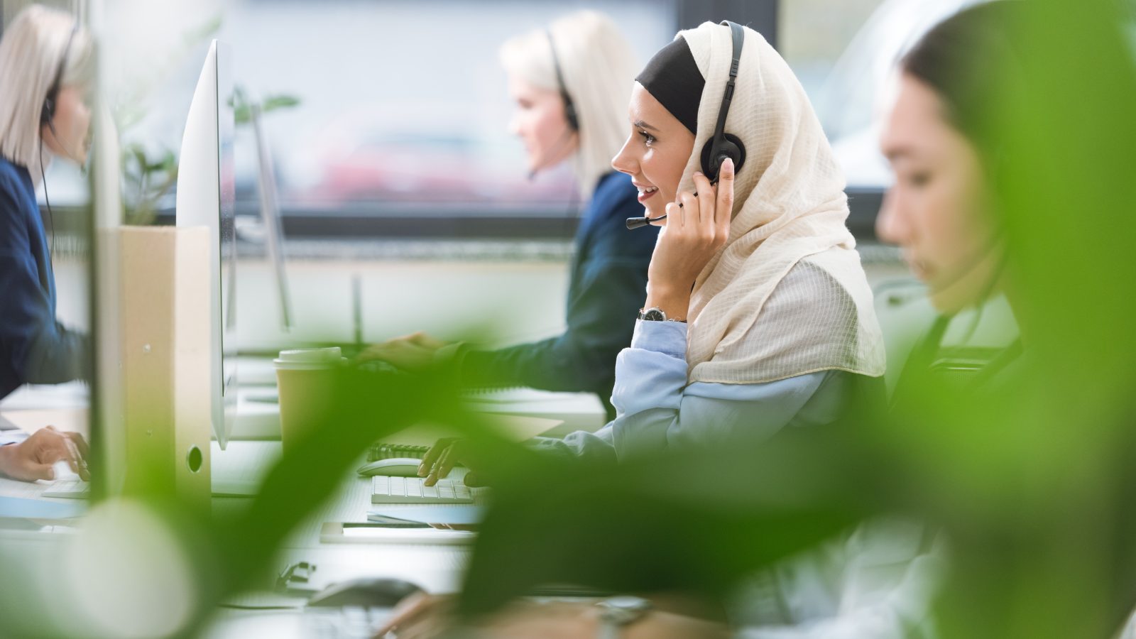 call center operator in headset at workplace