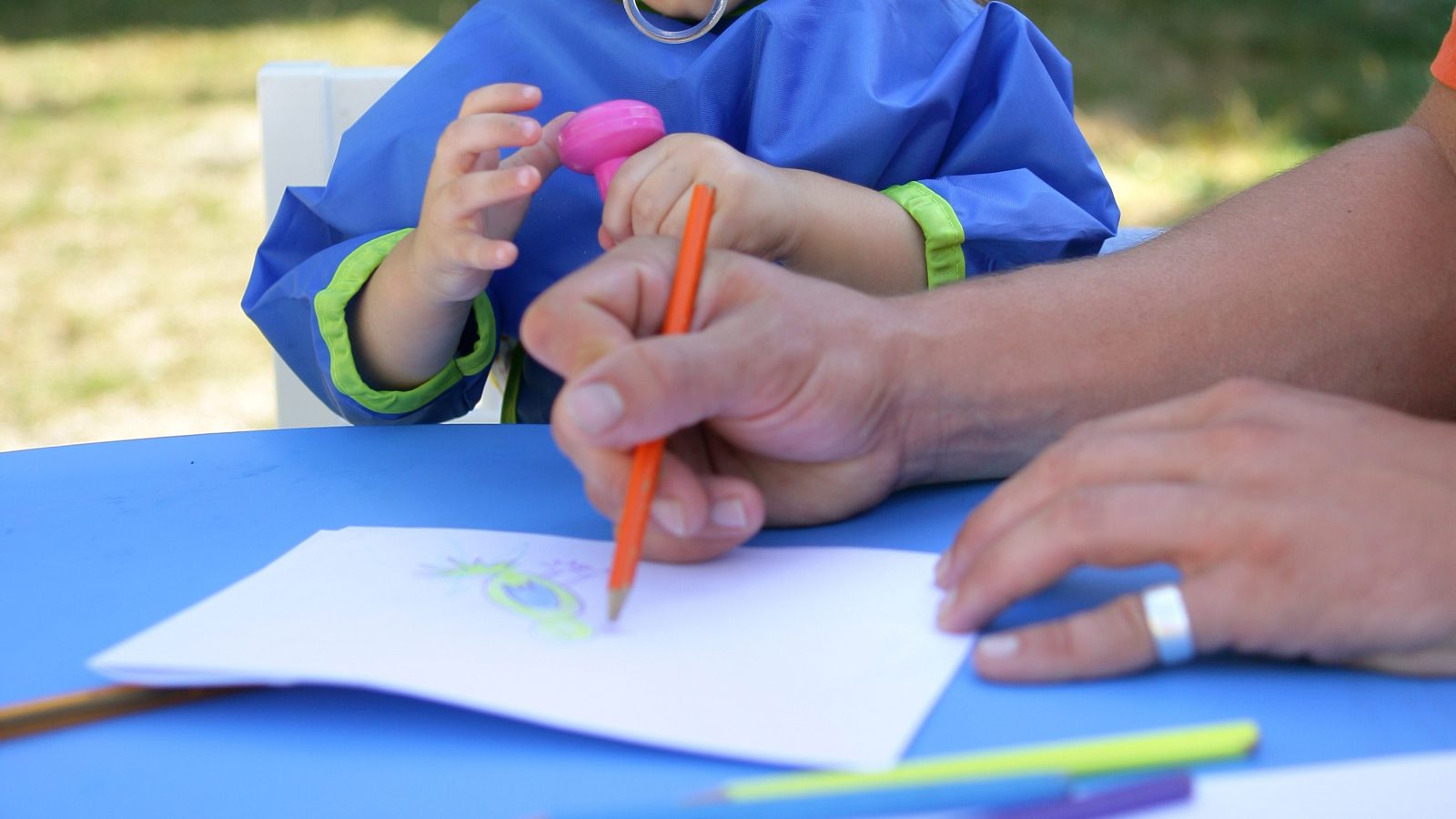 A toddler playing outdoors