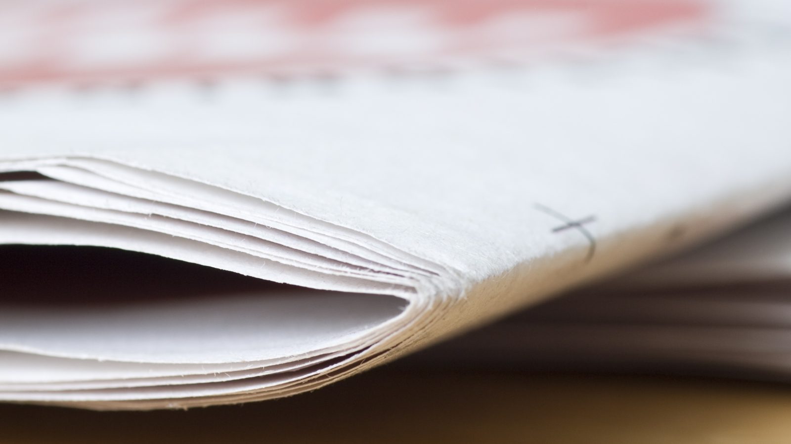 newspaper on wooden table