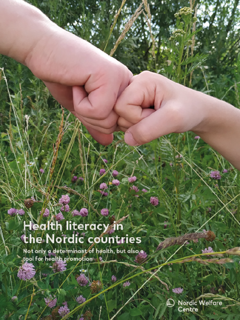 The hand of a child and the hand of an adult fist bumping among flowers.