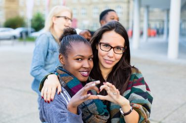 Diversity friends in city, group of African, Asian and Caucasian people